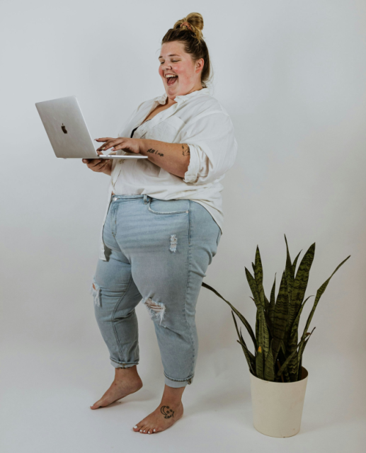 Successful-website-launch-satisfied-Local-Label-client-.webp Smiling Perth business owner checking Google Analytics showing website traffic growth and successful SEO campaign results